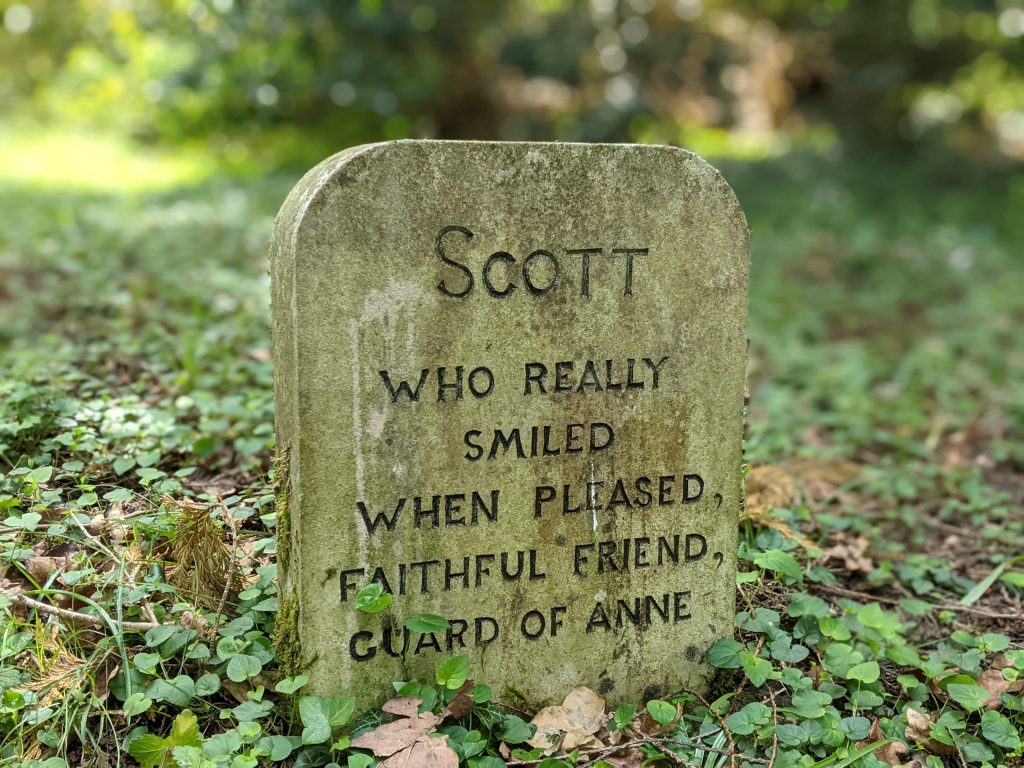Gravestone with the text - Scott who really smiled when pleased, faithful friend, guard of Anne.